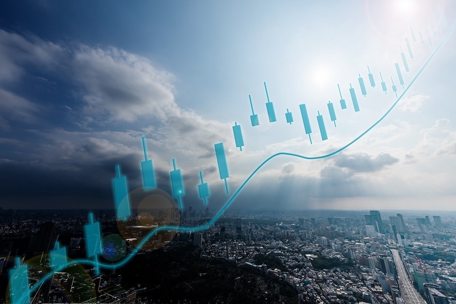 都市風景と株価上昇チャート