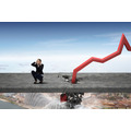 <p>Scared businesswoman and falling red arrow destroying concrete barrier</p>