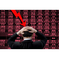 <p>Businessman put his hands on his head feeling nervous and anxious about bad business. Red decline economic and stock market graph in background.</p>