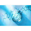 <p>Candle stick graph chart of stock market investment trading with a clock</p>